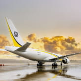 An MSC-branded cargo airplane parked on a wet tarmac, reflecting MSC's air freight capabilities and logistics services.