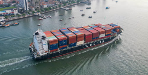 A Log-In cargo ship carrying colorful shipping containers.