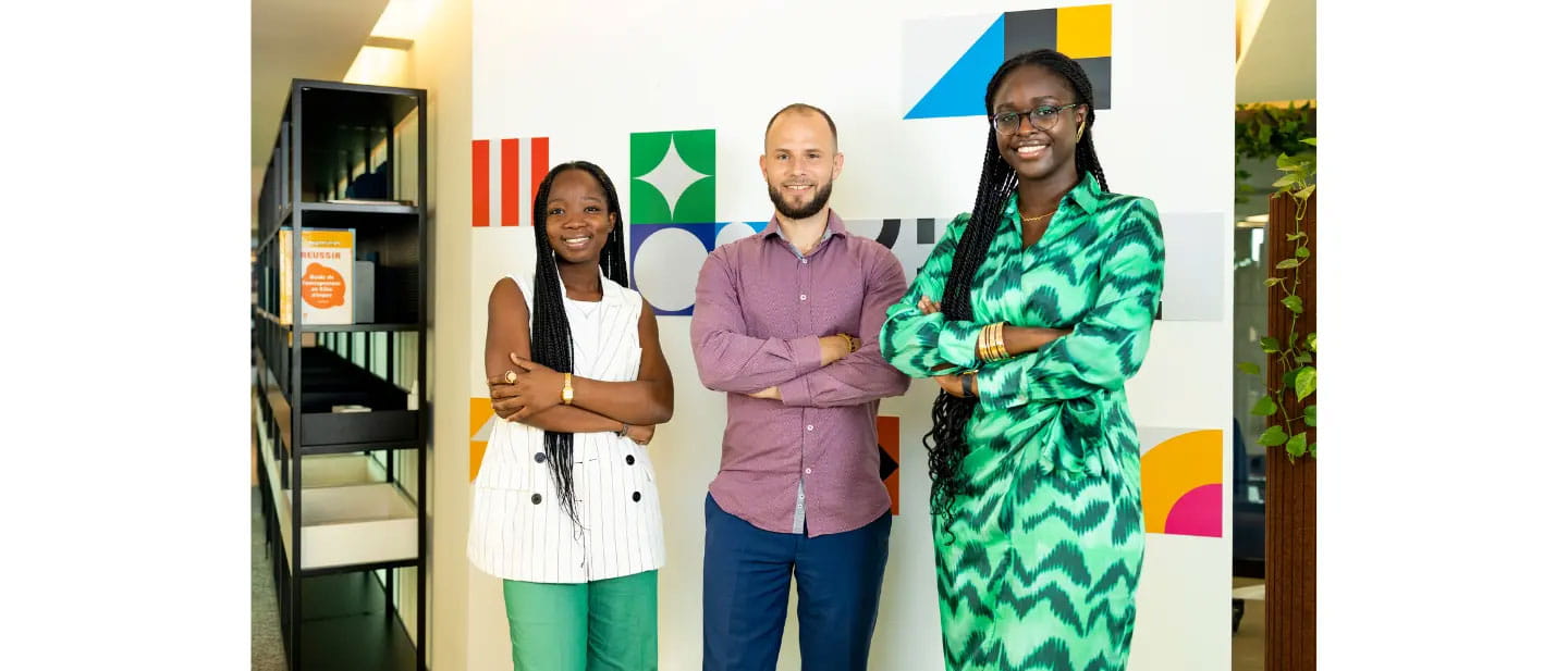 Three young professionals associated with Yiri, AGL’s innovation centre, smile for a photo